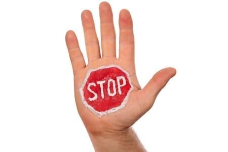 Image of hand with a stop sign on the palm