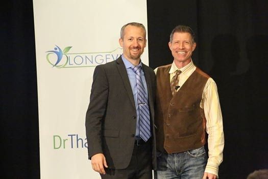 Image of Dave with client at conference