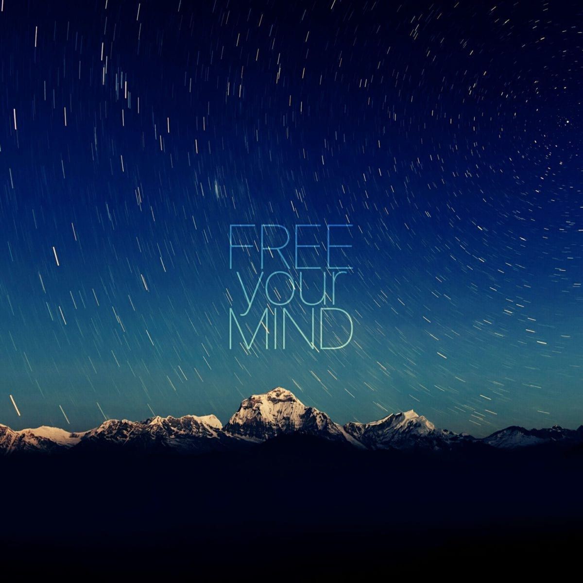 Image of a mountain with sky and the words "free your mind"