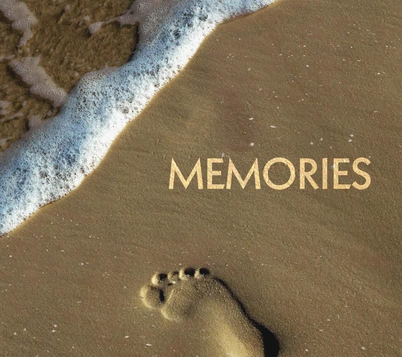 Image of beach with a foot print and the word memories