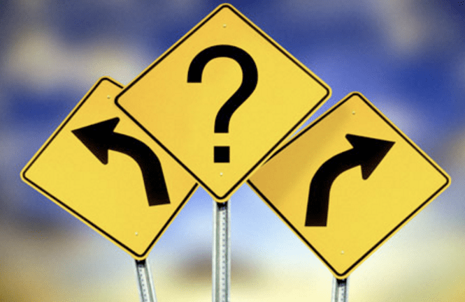 Image of road signs going left, right, or a question mark